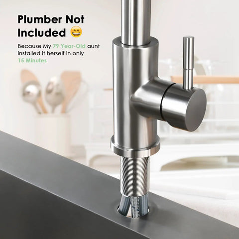Close-up of Premium Stainless Steel Pull Down Kitchen Faucet With Three Mode Spray Head installed in a kitchen sink.
