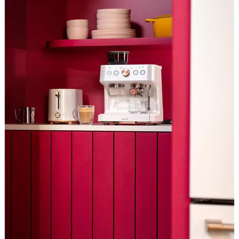 Next Level Semi Automatic Espresso Machine With Badass Built In Grinder And Silky Milk Frother Featuring WiFi App Control Custom Drinks 15 Bar Pump 95 Oz Water Tank Matte White Copper Accents on a kitchen counter.