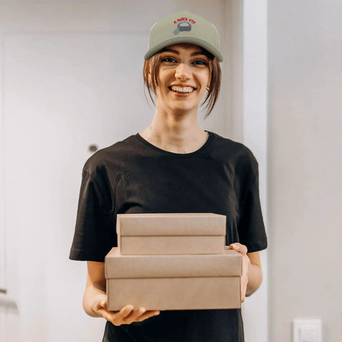 Person wearing Apricot Baseball Cap For Men Camp Hat Sun Shield With Printed Design holding gift boxes indoors.