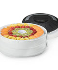 Electric Food Dehydrator With Four Stackable Trays And Top Mounted Fan displaying sliced fruits ready for drying.