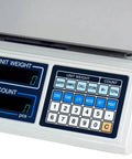 Close-up view of SC Series Precision Counting Scale with 50 pound capacity, showing keypad and LED displays for batch counting.