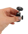Close-up of hand holding a part of the Dope Camera Mount Screw Kit For Your Rig With Quarter Inch components.