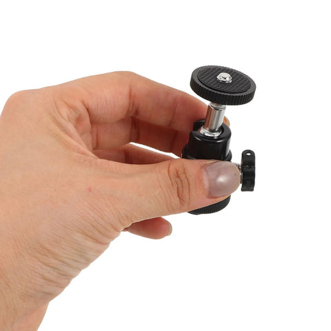 Close-up of hand holding a part of the Dope Camera Mount Screw Kit For Your Rig With Quarter Inch components.