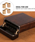 Two copper hidden bracket hinges for jewelry boxes; gold-tone recessed cabinet hardware.