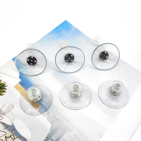 Heavy Duty 6 Piece Suction Cups With Metal Screw Threaded Rod, clear PVC holders laid out on a colorful background