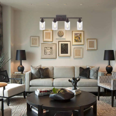 Living room with set of 4 oil rubbed bronze wall sconces with clear glass cylinders, upward mount, modern lighting fixtures.