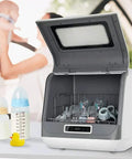 No Sweat Compact Countertop Dishwasher With Automatic Air Dry And 360 Rotating Dual Spray Heads Superfast Cycle For Everyday Dishes Bowls And Fresh Market Finds with baby bottles and glasses inside.