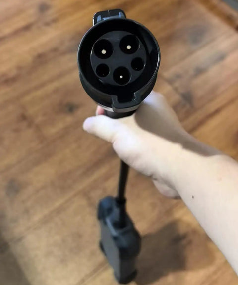 EVSE Charger Tester For Electric Vehicle Charging Stations Plug And Play Simulation Adapter Trigger, handheld view of Type 2 connector.