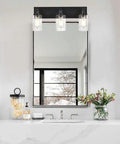 Three Light Vanity Bathroom Light Fixture Over Mirror Black Finish With Cylinder Seeded Glass Shades For A Sleek Dope Look