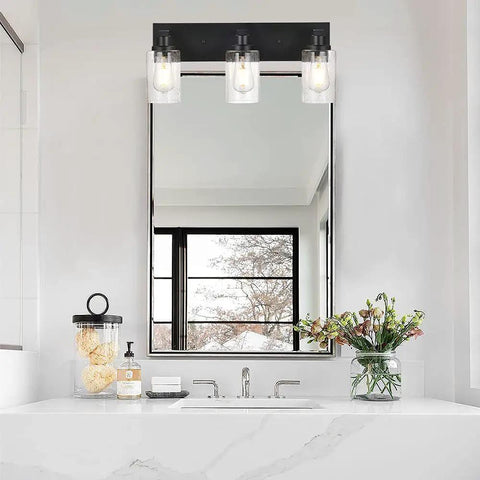 Three Light Vanity Bathroom Light Fixture Over Mirror Black Finish With Cylinder Seeded Glass Shades For A Sleek Dope Look