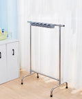 Movable Broom And Mop Holder With Wheels, portable metal tower for organizing cleaning tools, shown in indoor setting