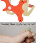 Ultra Compact Mini Slingshot With Flat And Round Bands In Red Nylon Fiber, handheld showcasing grip and ambidextrous design.