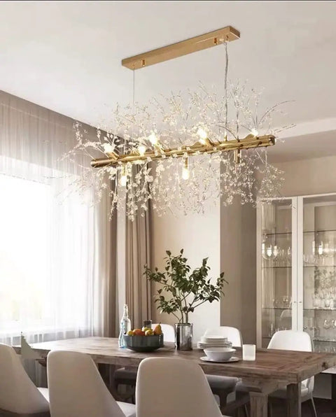 Crystal Bubble Sputnik Chandelier With Dope Firework Lights, Modern White Pendant in dining room over wooden table, gold finish.