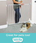 Hardware Mounted Metal Baby Gate For Stairs And Doorways, Walk Through Child Safety Barrier With Zero Threshold, Adjustable Up To Forty Inches Wide, Thirty Inches Tall, Crisp White in doorway with child and dog.