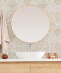 Bathroom featuring Pink Bohemian Damask Peel And Stick Wallpaper Removable Repositionable Boho Wall Covering For Easy DIY Decor No Glue Needed Mess Free 20.5 In By 16.5 Ft Made In The USA Great For Accent Walls And Furniture Refresh behind a round mirror and sink.