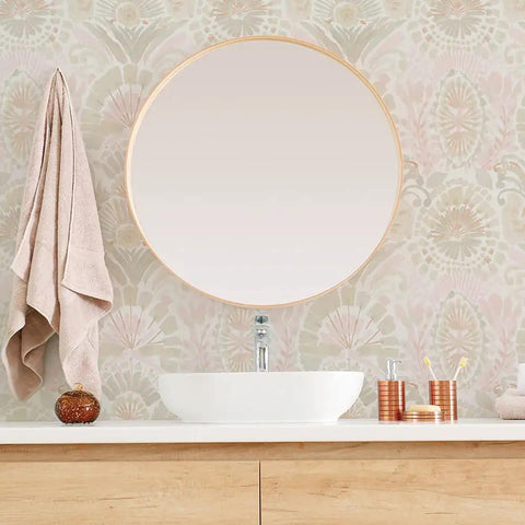 Bathroom featuring Pink Bohemian Damask Peel And Stick Wallpaper Removable Repositionable Boho Wall Covering For Easy DIY Decor No Glue Needed Mess Free 20.5 In By 16.5 Ft Made In The USA Great For Accent Walls And Furniture Refresh behind a round mirror and sink.