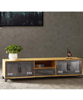 Killer Industrial Solid Wood TV Console With Hella Roomy Storage Drawers Closed Cabinets And Vintage Iron Details with plants