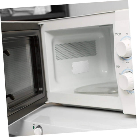 Open microwave showing installed 10 Piece Mica Insulation Sheets For Microwave Ovens, heat resistant waveguide cover inside compartment.