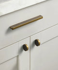 Six Pack Antique Brass Finger Pulls For Cabinets And Drawers, Solid Zinc Alloy Hardware installed on white cabinet, vintage style