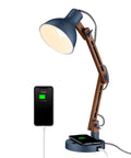 Sapele Wood Desk Lamp With Upgraded Wireless Charger And USB C Port Swing Arm Reading Light For Bedroom Dorm Office And Living Room LED Bulb Included In A Dope Blue Finish showing phone charging.