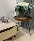 Built Different 16.5 Inch Folding Hairpin Table Legs Set Of 3 Solid Steel Frame Sleek Black Finish supporting a wooden round tray with flowers.
