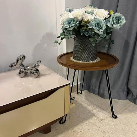 Built Different 16.5 Inch Folding Hairpin Table Legs Set Of 3 Solid Steel Frame Sleek Black Finish supporting a wooden round tray with flowers.