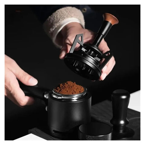 Smooth Operator Espresso Rotary WDT Tool And Coffee Stirrer With Built In Dosing Funnel Stand For Even Powder Distribution and Knockout Barista Shots At 54mm in use with coffee grounds.