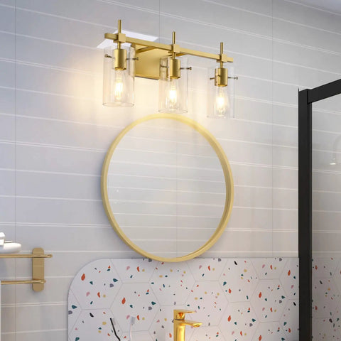 Gold Three Light Bathroom Vanity Fixture Set For Mirror And Wall Sconce in modern bathroom setting with round mirror