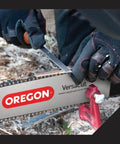 Oregon 27742 depth gauge tool with flat file for chainsaw chain, in use on saw bar with red clamp