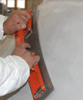 Flexisander Hand Held Flexible Sanding Block for Curved and Flat Surfaces in use on curved surface