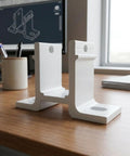 White outdoor awning mounting bracket on desk, rigid metal slotted aluminum bent base; for patio garage support beams weatherproof
