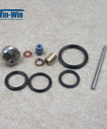 Front view of waterjet maintenance kit parts: O-rings, brass valve fitting, blue spacer, copper washers, stainless rod.