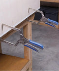 Automaxx Right Angle Clamp Set Two Pack securing wood board, showing auto thickness adjustment and 90 degree joints with contoured grips.