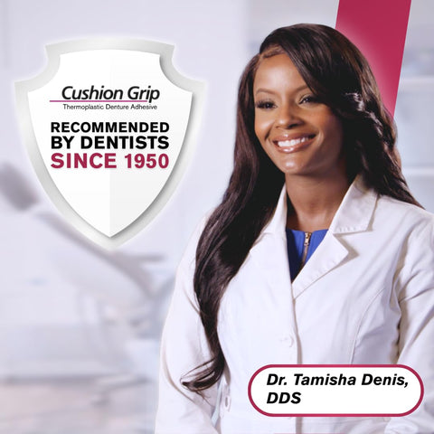 Shield with 'Cushion Grip' text and smiling dentist promoting Thermoplastic Denture Adhesive That Refits And Tightens Loose Dentures For A Long Lasting Snug Fit That Keeps Them From Slipping And Cushions Gums While Acting Like A Soft Reliner Prevents Food From Underneath Waterproof And Zinc Free 1 Oz.