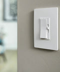 Screwless 1 Gang Decorator Wall Plates 20 Pack Low Profile Snap On Design Durable Polycarbonate in white on wall.