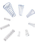 Assorted metal springs from Grab And Go Compression Springs Kit 100 Pieces set, showcasing varied sizes and shapes of 304 stainless steel springs.