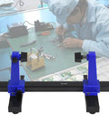 Adjustable PCB Holder And Soldering Stand with Rotating Clamps for DIY Electronics in use on a workbench