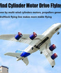 Beginner Friendly Four Motor RC Airplane With 2 4G Remote Control EPP Crash Resistant Auto Stabilization flying in blue sky