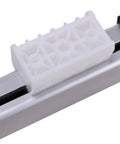 Close-up of KDPT005190 Linear Actuator component showing white plastic part on metallic rail, for power recliner lift chair replacement.