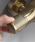 Close-up of dual handle mixer shower control for UMJIGF 10 Inch Shower System Brushed Gold Shower Faucet Set.