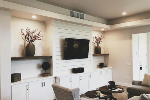 Pro Grade Black Bogwood Reactive Water Based Interior Wood Stain In A Heavy Duty 55 Gallon Drum displayed in a modern living room.