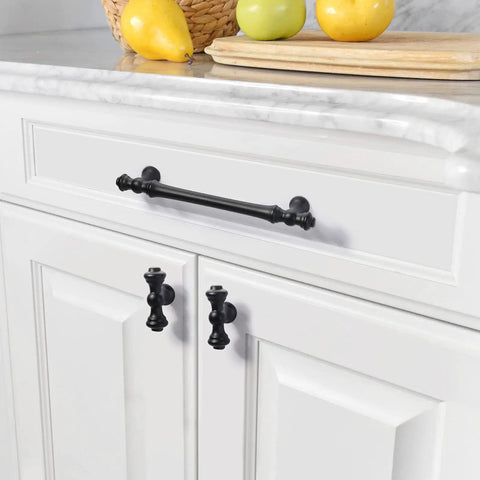 Premium Matte Black Cabinet Knobs For Kitchen And Dressers Featuring Durable Zinc Construction on white cabinet doors.