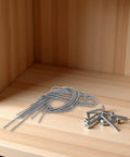 Five Pack Stainless Steel Extension Springs For Machinery And Linkage, 2.4 Mm Inner Diameter, Heavy Duty Industrial Grade, Ideal For Automation Feedback, DIY Repairs, And Quick Machine Adjustments, coiled springs and screws on wood shelf