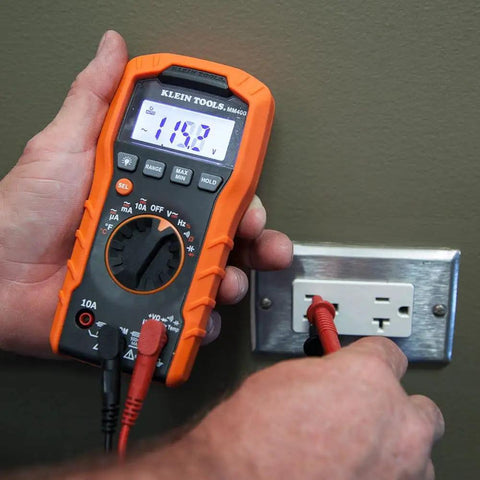 Hands using a multimeter with Replacement Test Lead Set, Right Angle Probes With Removable Alligator Clips, Universal Banana Inputs
