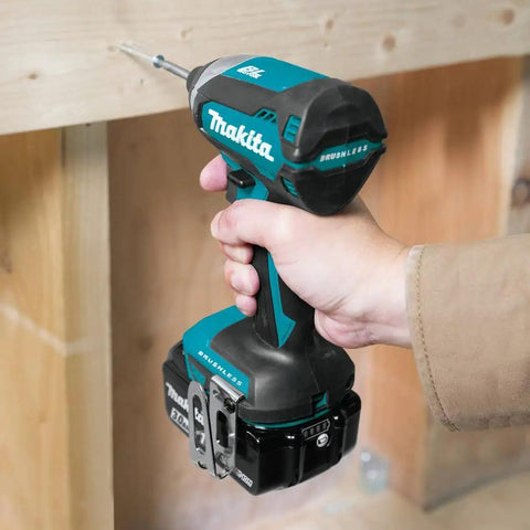 Person using 18V Brushless Cordless Impact Driver Kit XDT131 with 3.0Ah Battery for woodwork, showing ergonomic grip.