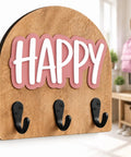 Personalized Wall Hook With Custom Name, Sweet Three Hook Wall Mounted Organizer For Backpacks And Coats in pink with wood background.