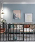 Extra Wide Baby Gate Black 65 To 68 Inches Walk Through Safety Gate For Kids And Pets Pressure Mounted in living room