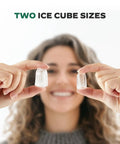 Person holding two ice cube sizes from Countertop Ice Maker With Spring Loaded Expanding Ice Basket Holds 2.5L Of Ice And Up To 9 Cups