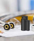 100 Pcs Black Flat Rubber Washers Kit With 5 Sizes 16 18 20 25 30mm next to metal pipes and bearings for plumbing repairs