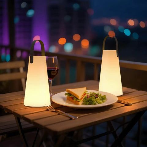Rechargeable Cordless Outdoor Lanterns With Dope RGB Colors illuminating a table with food and wine on a balcony at night